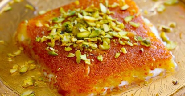 Kanafeh is a Levantine Arabic dish, which is very popular as a dessert in Israel. It’s basically a cheese pastry soaked in sweet sugar-based syrup. First, you take the pastry and heat it in butter. Next, you spread a white, soft cheese like Nabulsi cheese or goat’s cheese on top.