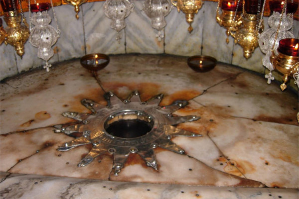 Touch the spot where Jesus was born within the Church of the Nativity in Bethlehem.
